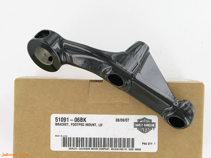   51091-06BK (51091-06BK): Footpeg mount, left - NOS - V-rod '06-'08